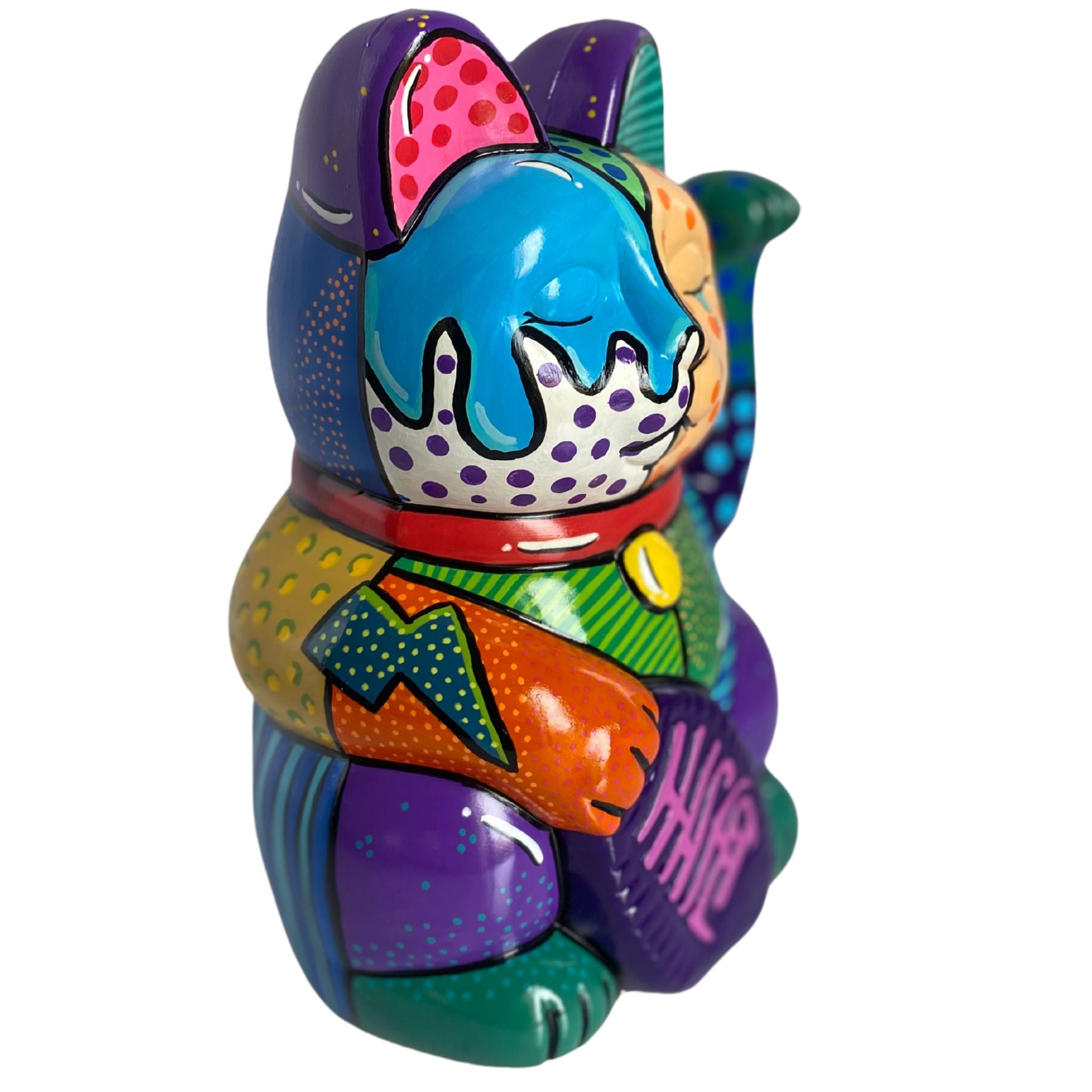 Colorful lucky cat figurine with pop art design on a white background
