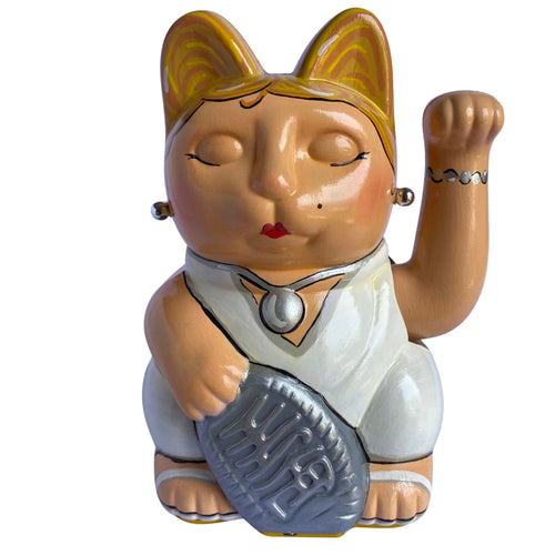 Lucy Cat-shaped figurine with a raised paw and silver coin on a white background